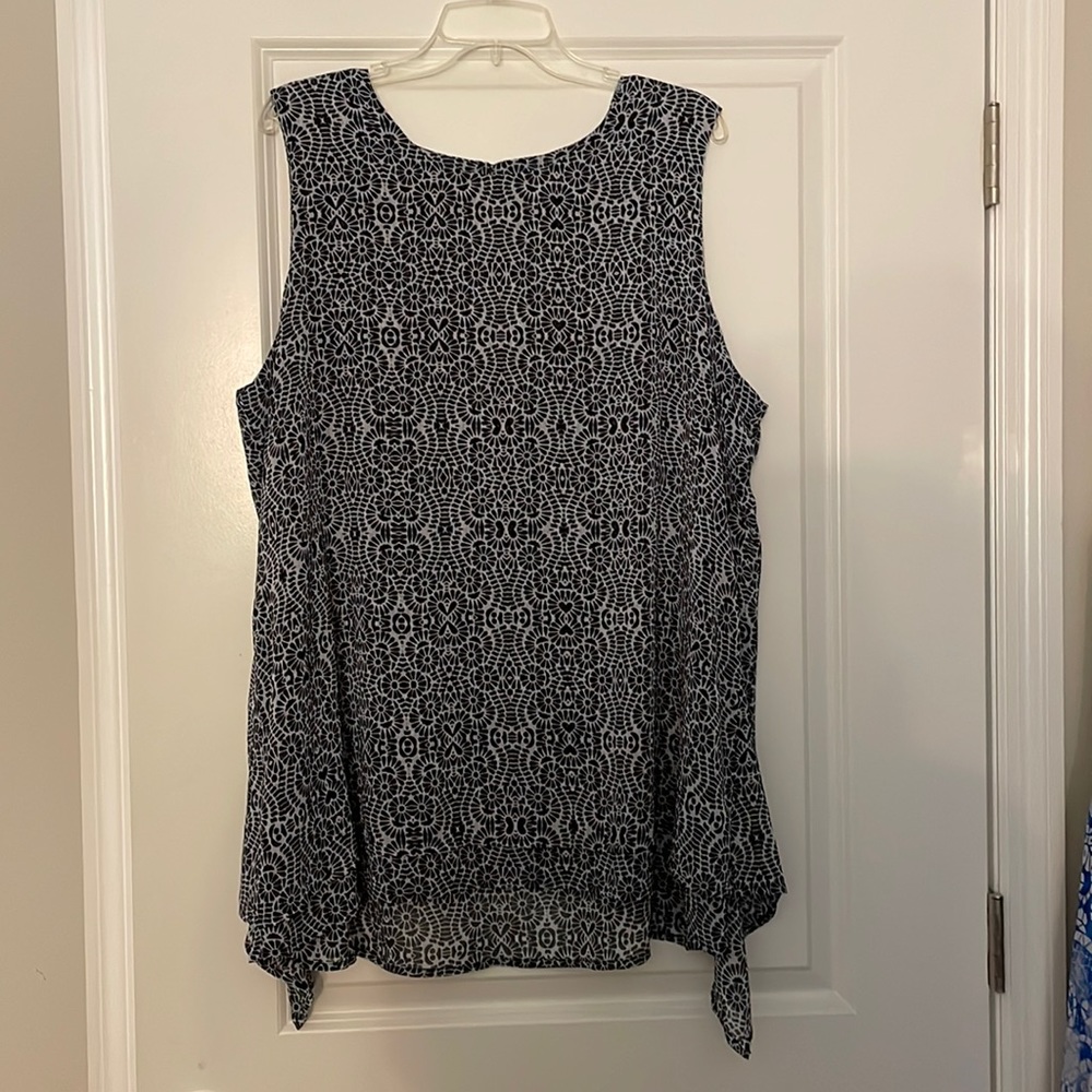 Sleeveless dressy top.  Black and white.